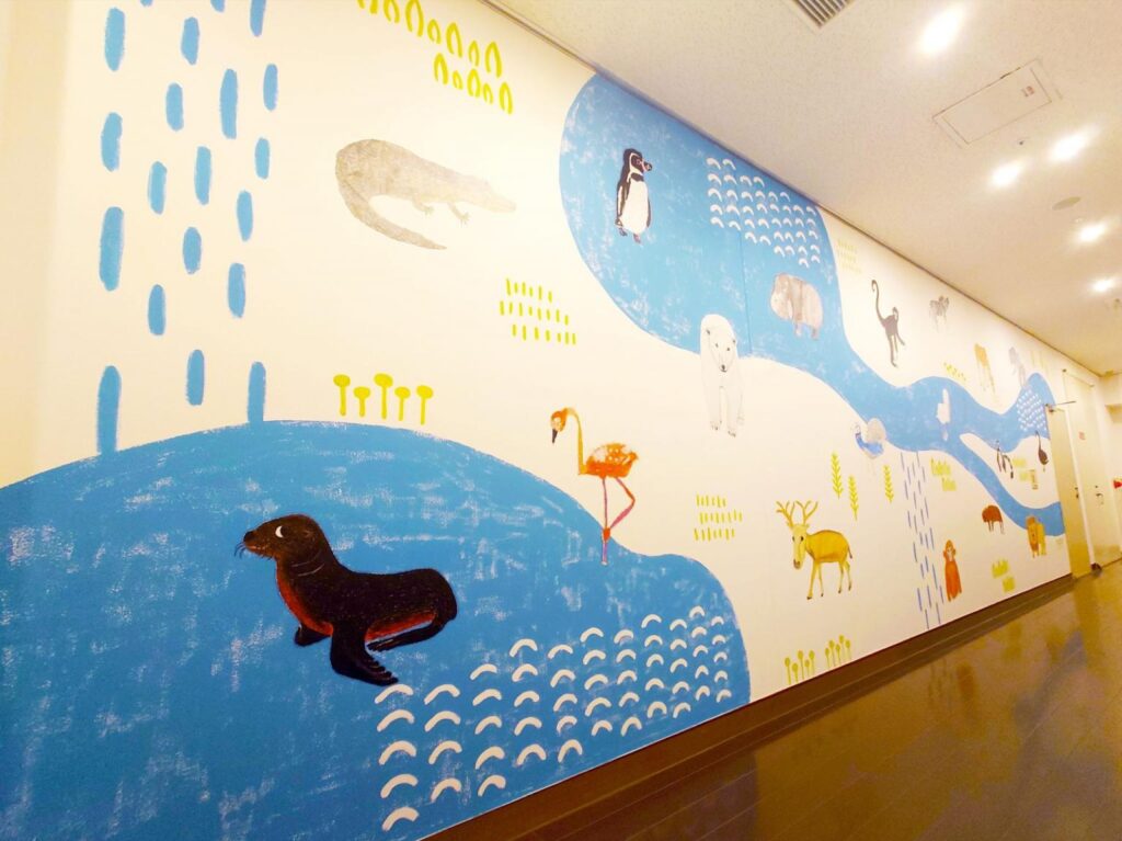 A long wall painted with animals and water inside the Contemporary Art Museum, Kumamoto